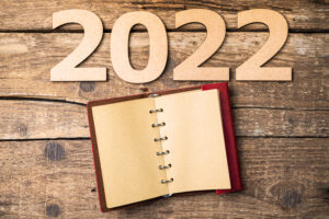 New year resolutions 2022 on desk. 2022 resolutions with open no